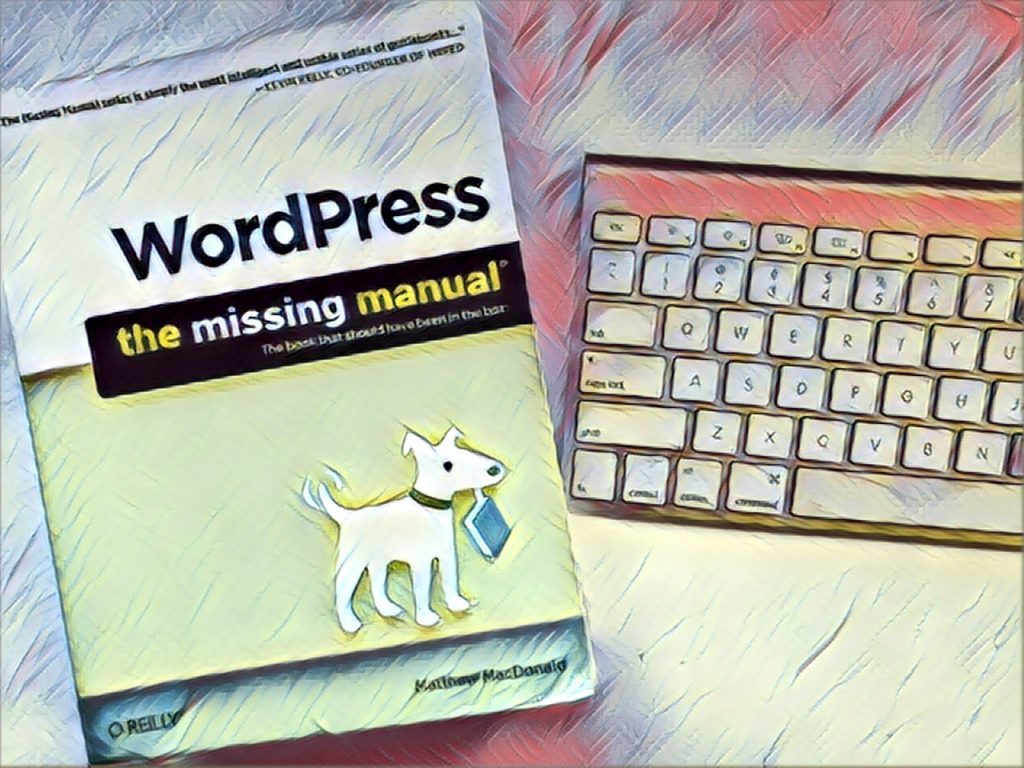 WordPress the Missing Manual sitting on desk next to keyboard